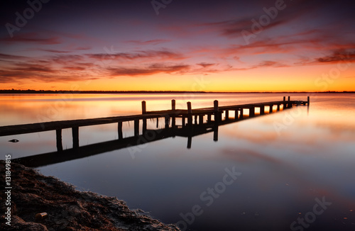 Beautiful skies over Tuggerah Lake with old jetty