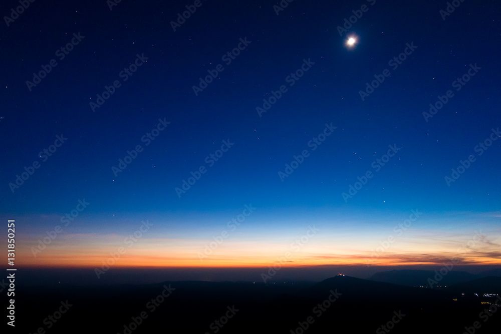 night sky with moon before sunset on mountain at Phu ruea of thailand for background