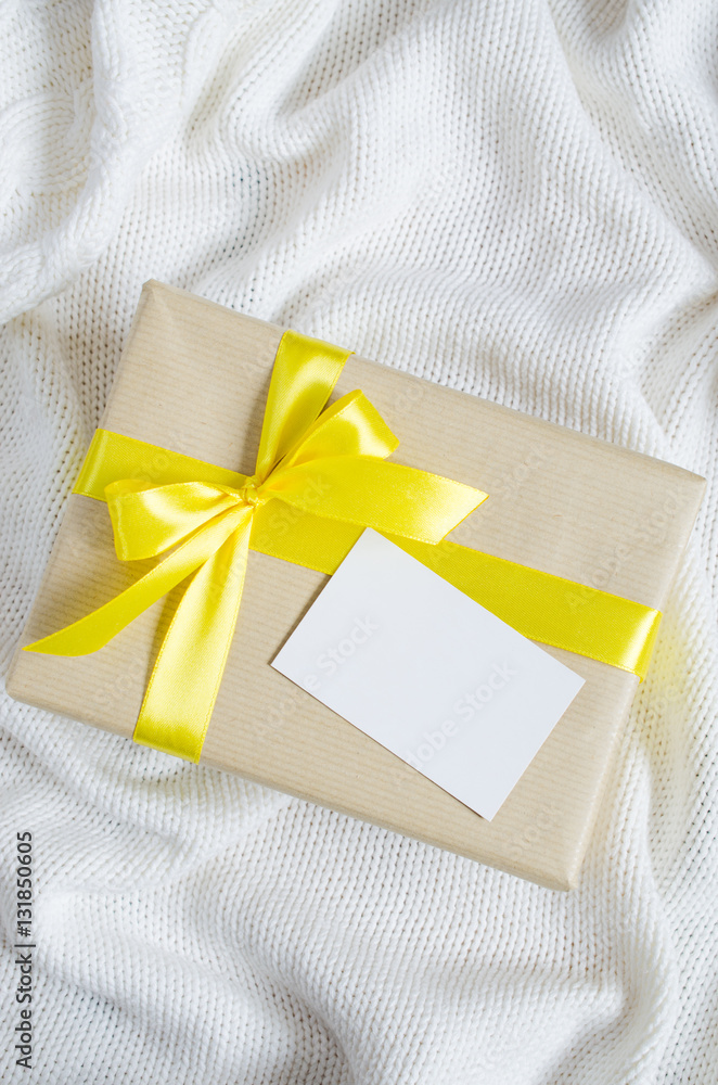 Gift Box. Present With Empty Postcard on Knitted blanket background