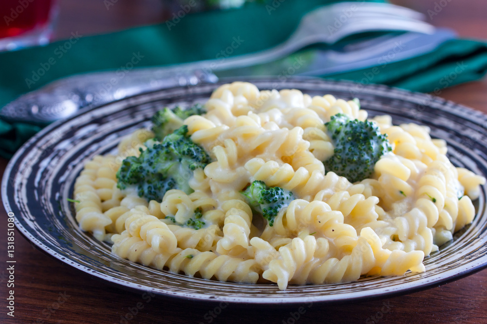 plate of penne pasta with broccoli and parmesan plate of penne pasta with broccoli and parmesan