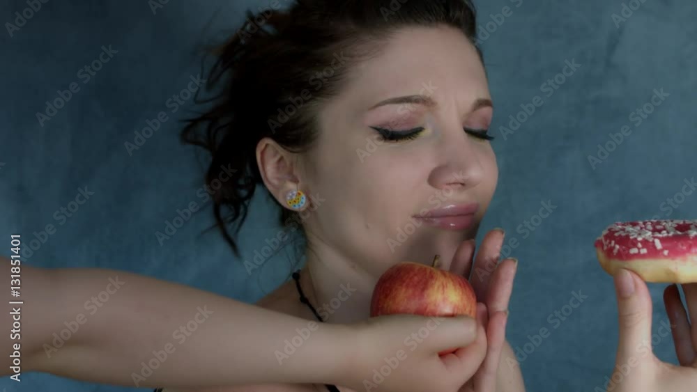 4k Shot of a Woman Posing in Studio with Donut, but appears Apple 4k Shot of a Woman Posing in Studio with Donut, but appears Apple
