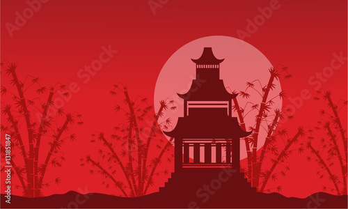 Silhouette of pavilion with bamboo background