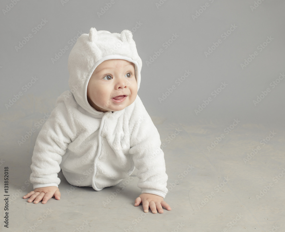 Caucasian baby plying isolated inside studio Caucasian baby plying isolated inside studio