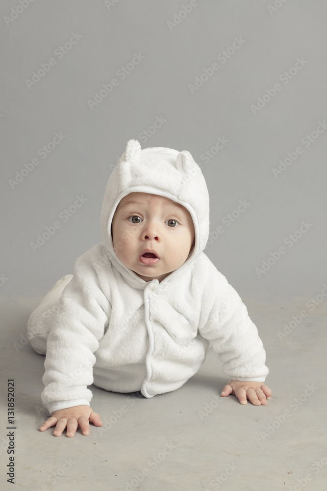 Caucasian baby plying isolated inside studio Caucasian baby plying isolated inside studio
