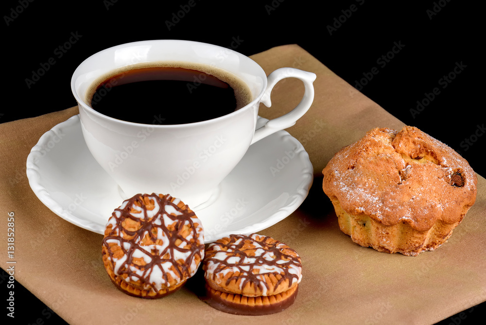 Cake, chocolate chip cookies and a cup of coffee on a black background Cake, chocolate chip cookies and a cup of coffee on a black background