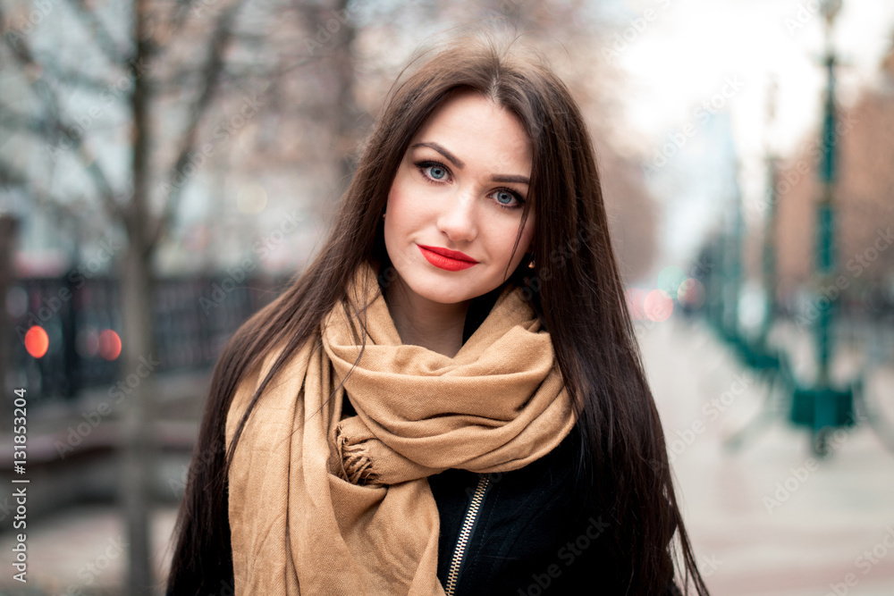 Autumn fashionable portrait of young happy brunette girl red lipstick outdoors in the city Autumn fashionable portrait of young happy brunette girl red lipstick outdoors in the city