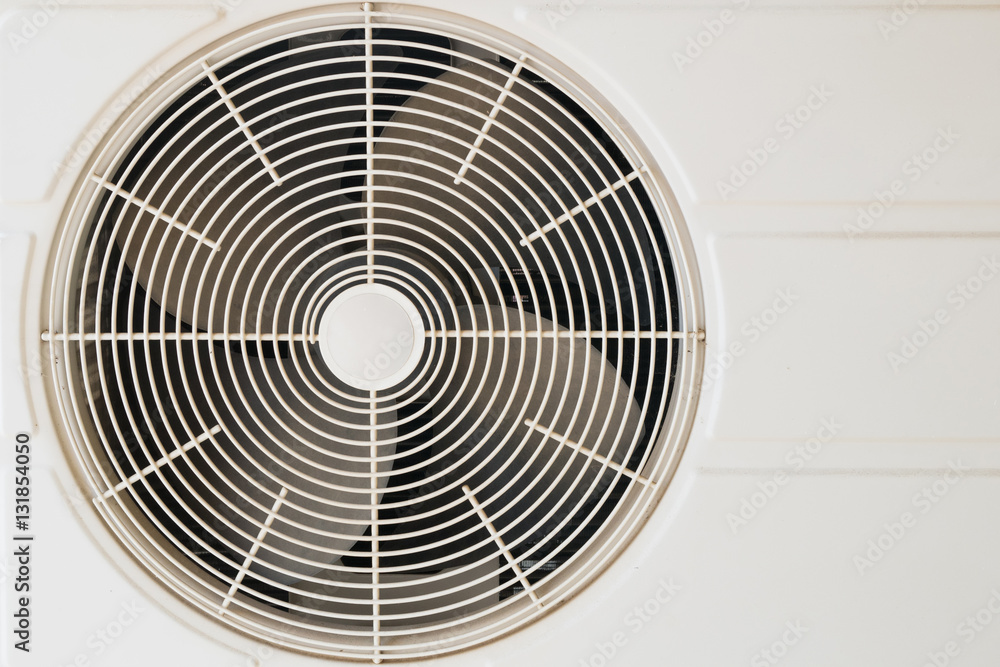 Foto Stock Condenser coil fan of an air conditioner Adobe Stock