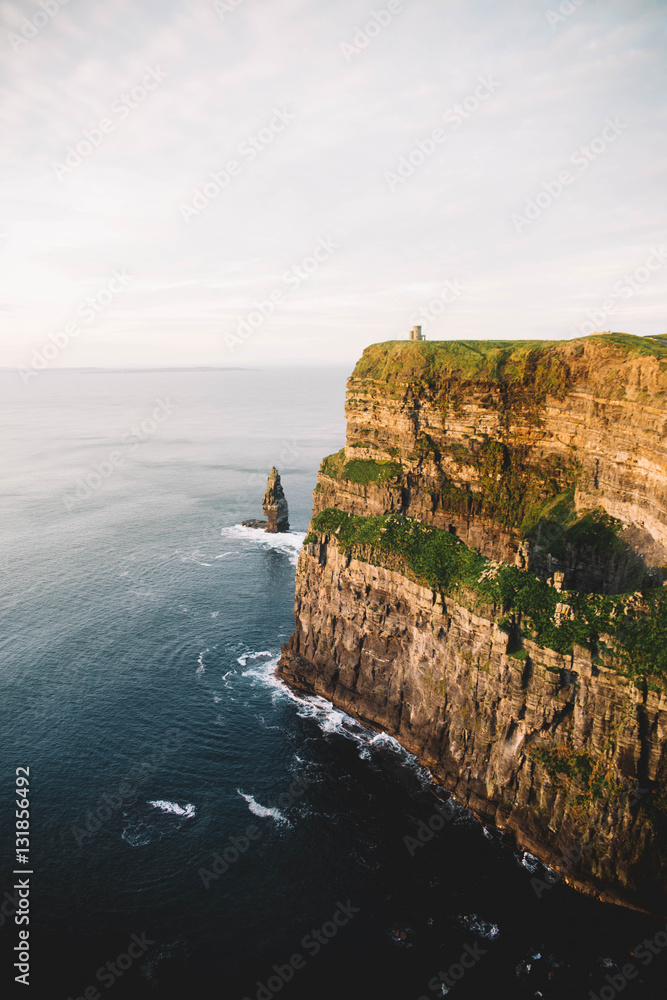 Mountain wall and peaceful seascape Mountain wall and peaceful seascape