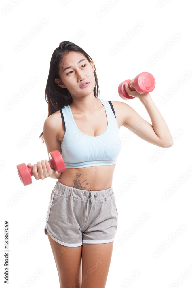 Tired Asian healthy girl exercise with dumbbell. Tired Asian healthy girl exercise with dumbbell.