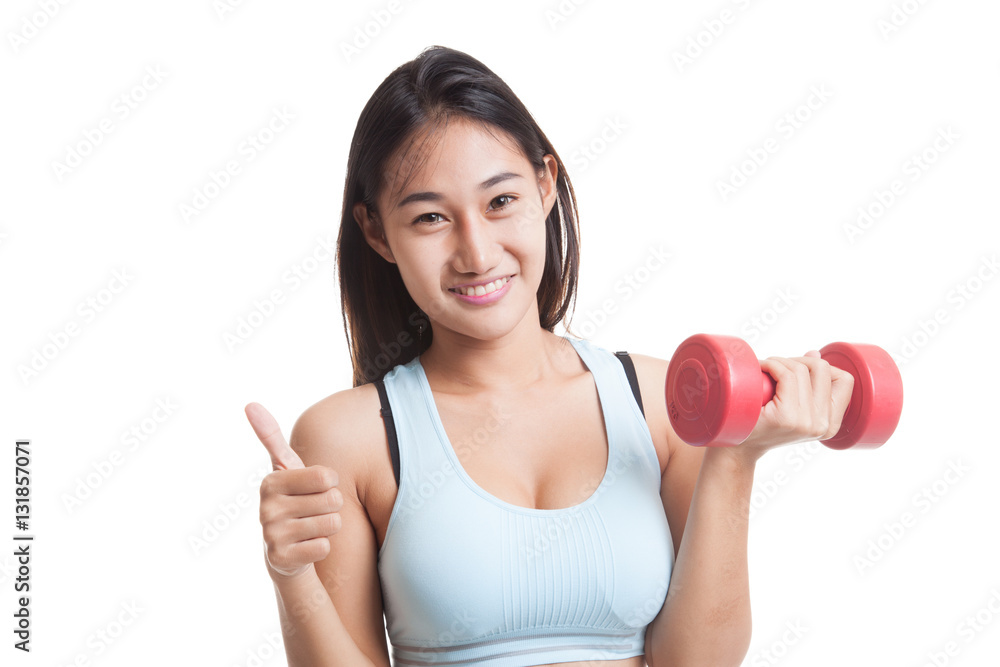 Beautiful Asian healthy girl thumbs up with dumbbell. Beautiful Asian healthy girl thumbs up with dumbbell.