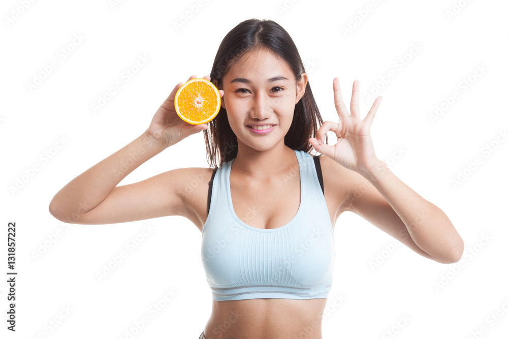 Beautiful Asian healthy girl show OK with orange fruit. Beautiful Asian healthy girl show OK with orange fruit.