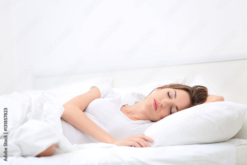 Young attractive woman sleeping in bed at home Young attractive woman sleeping in bed at home