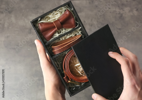 Male hand holding black box...