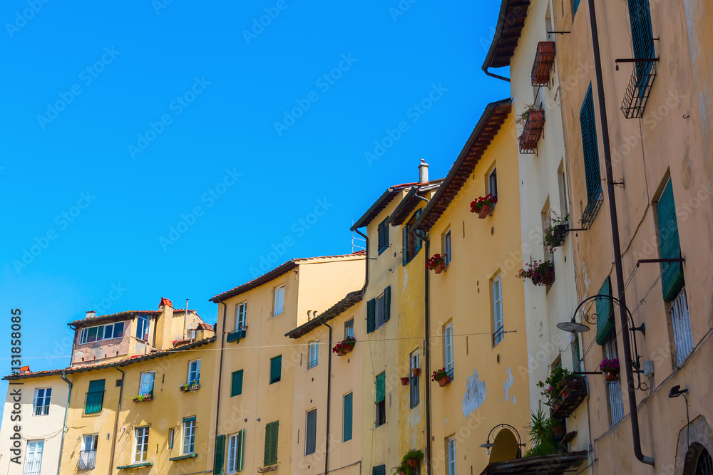 facades of old buildings in Lucca, Italy