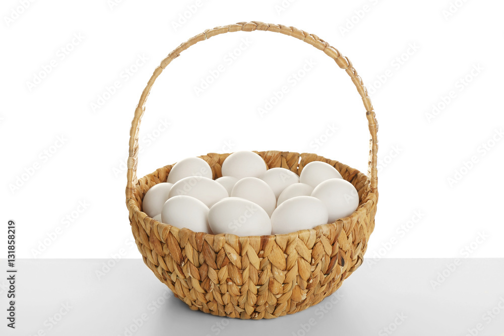Basket with eggs on white background Basket with eggs on white background