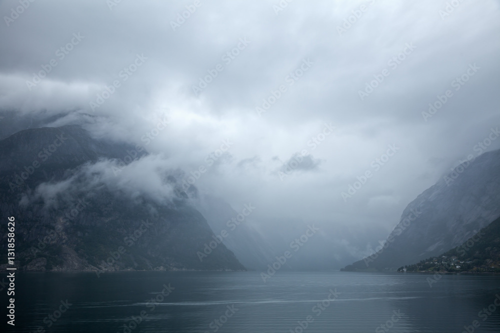 Norwegian landscape with Eidfjord, branch of the Hardangerfjord, the fourth longest fjord in the world and the second longest fjord in Norway Norwegian landscape with Eidfjord, branch of the Hardangerfjord, the fourth longest fjord in the world and the second longest fjord in Norway