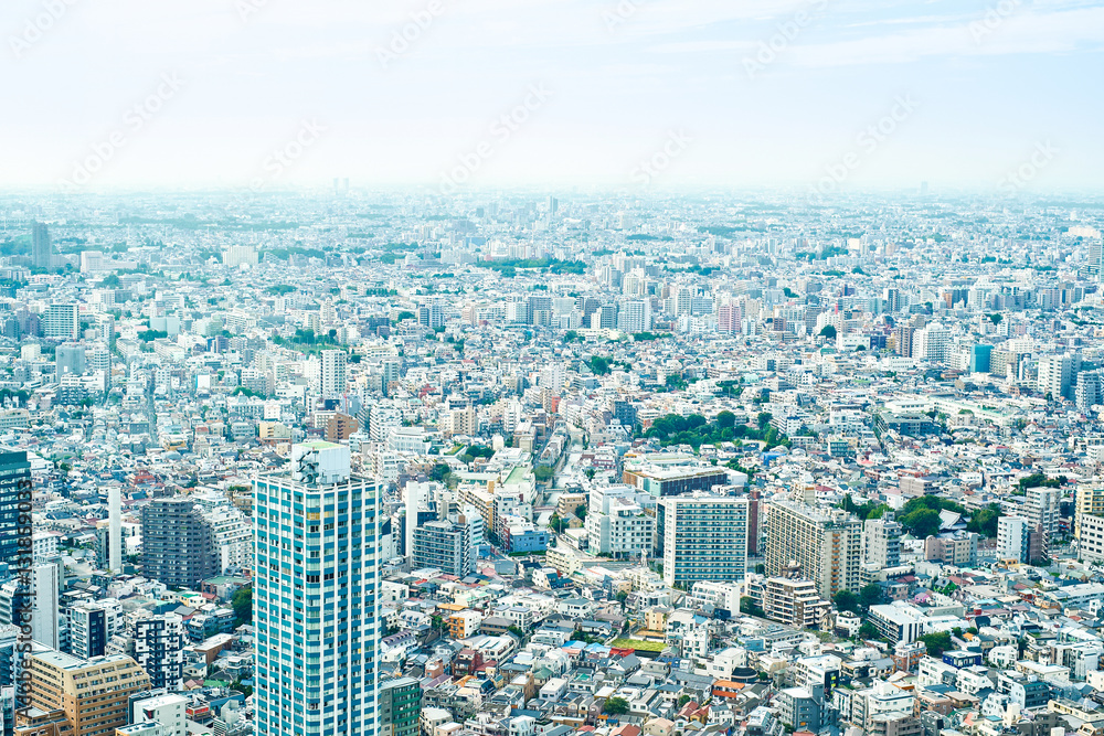 Asia Business concept for real estate and corporate construction - panoramic modern cityscape building bird eye aerial view under sunrise and morning blue bright sky in Tokyo, Japan