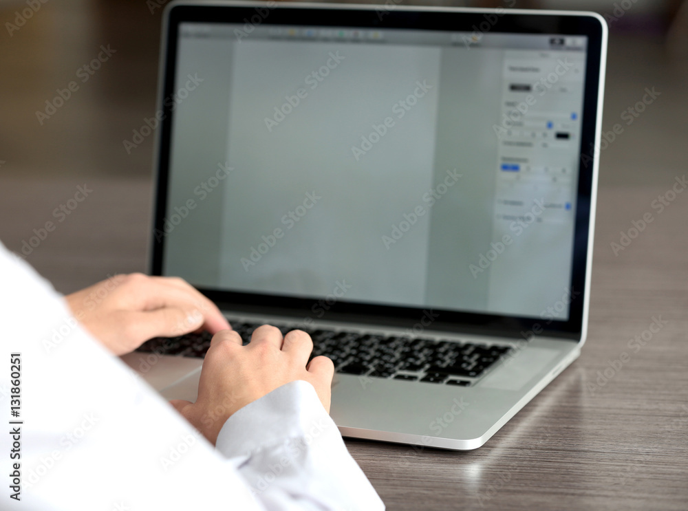 Businessman using laptop, close up Businessman using laptop, close up