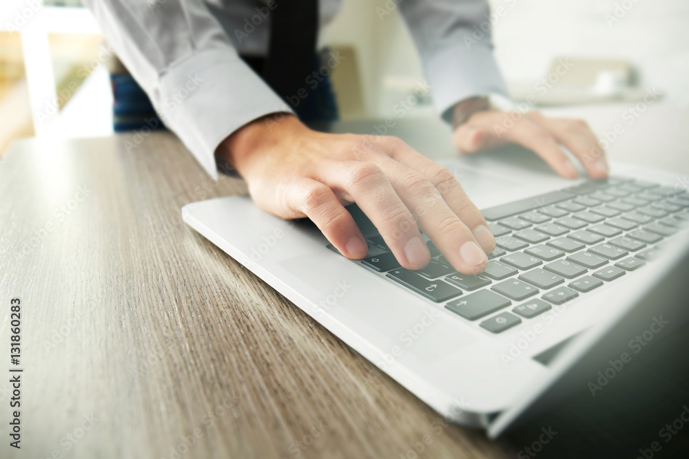 Businessman using laptop, close up Businessman using laptop, close up