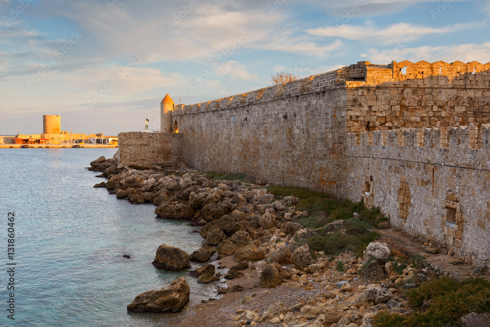 City walls and fortification of medieval harbor in town of Rhodes.