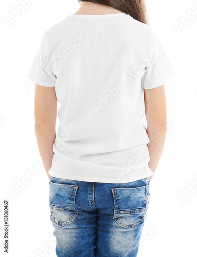 Little girl in blank t-shirt on white background, close up