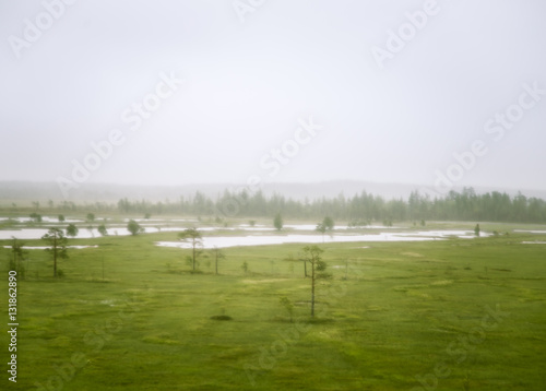 A beautiful Finnish mire landscape from above - dreamy, foggy look © dachux21