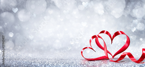 Fényképezés Valentines Day Decoration - Ribbon Shaped Hearts On Shiny Background