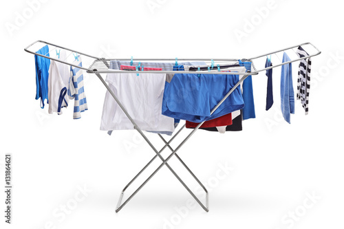 Cuadro en lienzo Rack dryer with clothes hanging