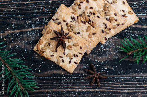 homemade cookies with sesame seeds and sunflower seeds on a wooden background Christmas theme