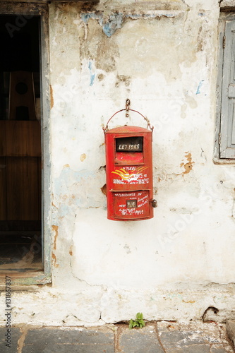 Indian post mail box hanging on rustic wall