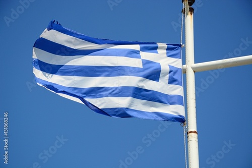 Greek flag against a blue sky, Crete. photo