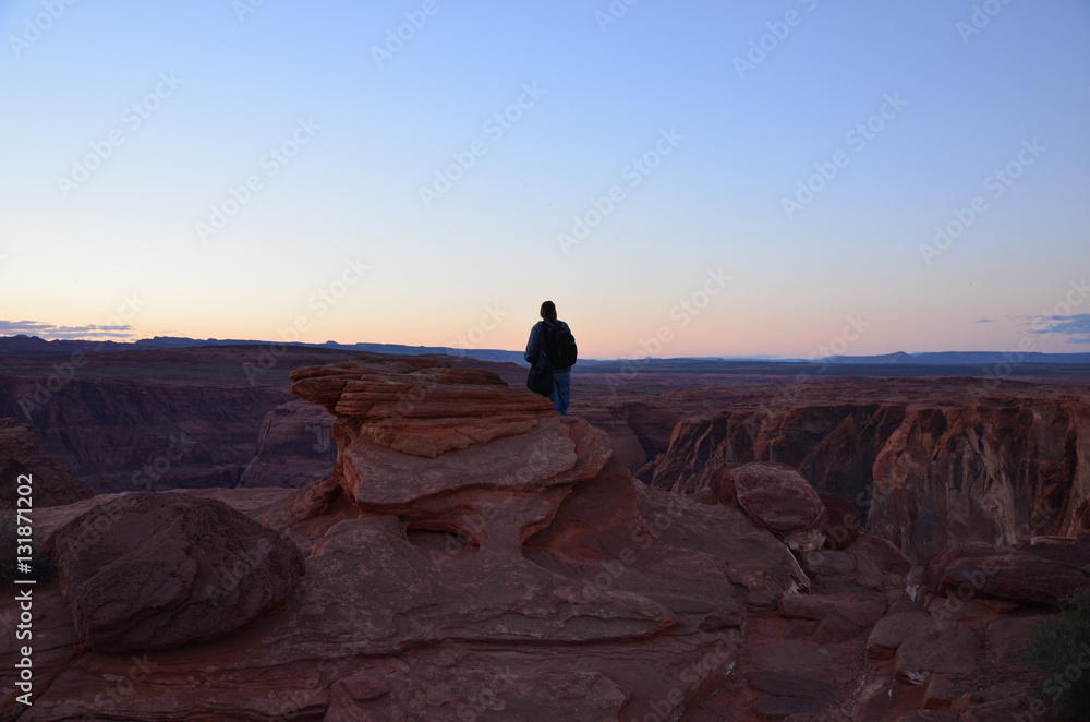 Silhouette of tourist looking at Horseshoe Bend, Arizona during Sunset