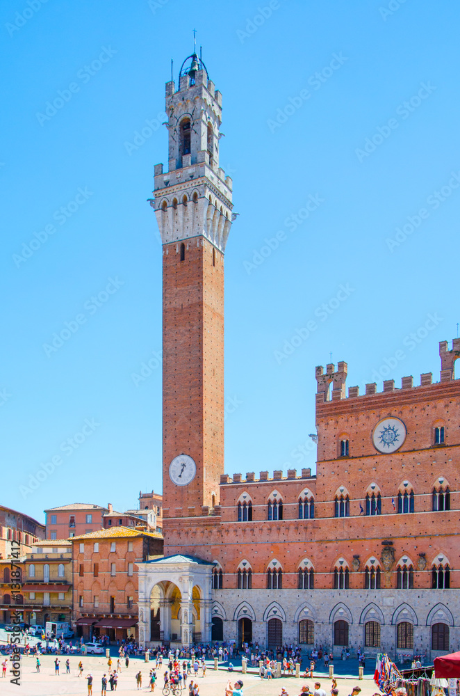 Piazza del Campo with Torre del Mangia, aka Tower of the Eater, in historic center of Siena, Tuscany region, Italy, Europe.
