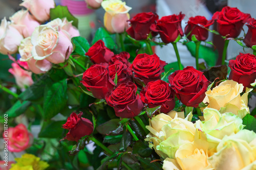 Beautiful colorful roses for sale at a florist's shop. © es0lex