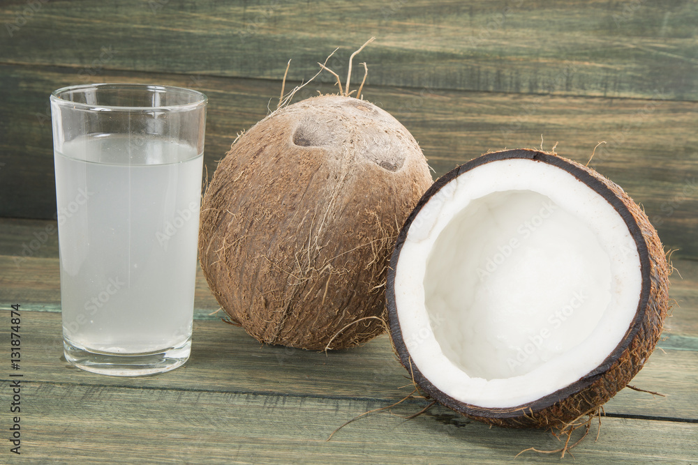 Coconut water on the wooden background (Cocos nucifera) Coconut water on the wooden background (Cocos nucifera)