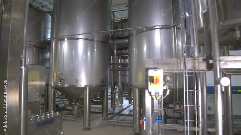 Storage Tanks in Brewery. Brewing factory indoors. Steadycam shot. 4K Storage Tanks in Brewery. Brewing factory indoors. Steadycam shot. 4K