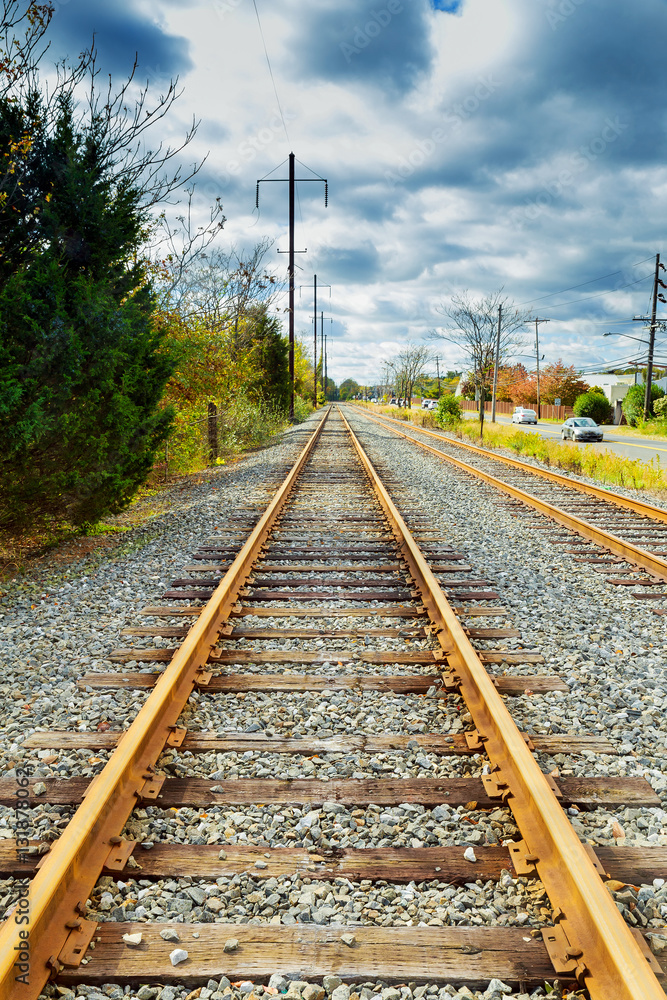 empty railway in autumn day with fallen leaves empty railway in autumn day with fallen leaves