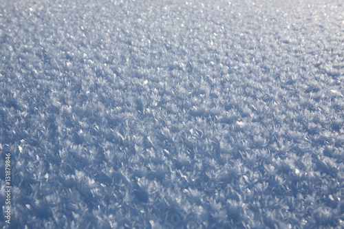 The natural texture of the snow, covered with crystals of frost