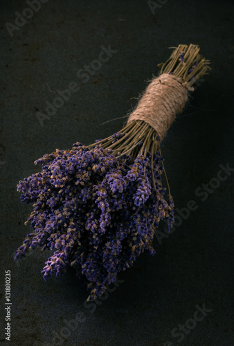 Fototapeta Naklejka Na Ścianę i Meble -  Bunch of purple lavender flower on dark tray