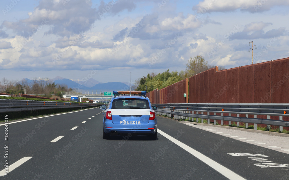 Italian police car patrolling on the highway
