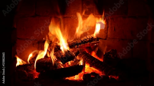 A fire burns in a fireplace