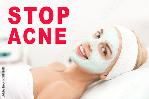 Young woman with facial mas...