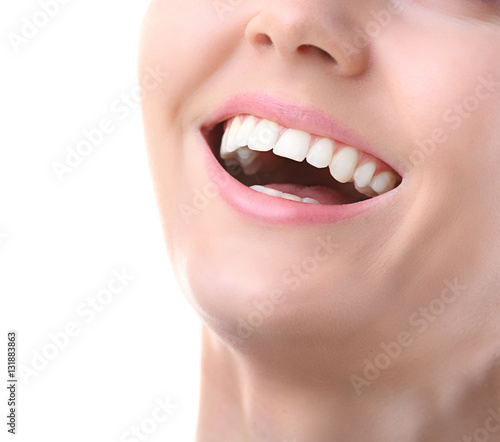 Young woman smiling on white background