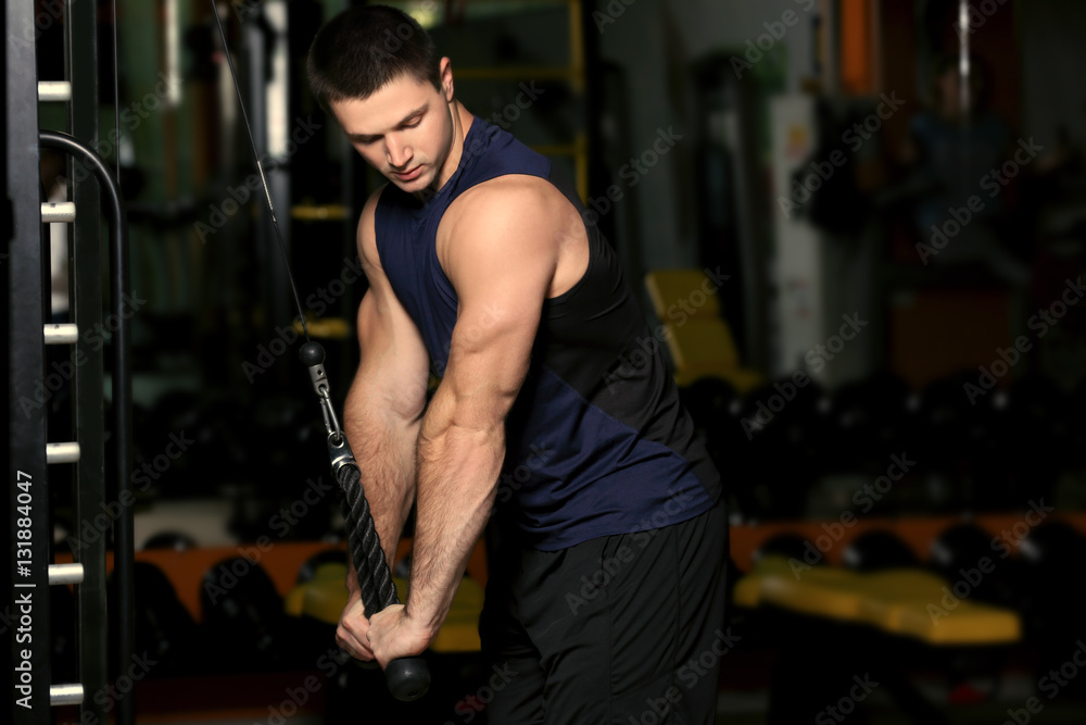 Young handsome man training in gym Young handsome man training in gym