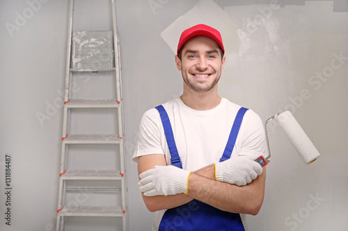Handsome worker with paint ...