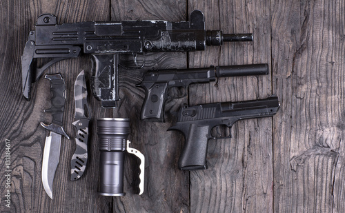 gun and two pistols,UZI submachine gun,firearms, terrorism