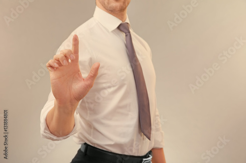 Young man showing something...