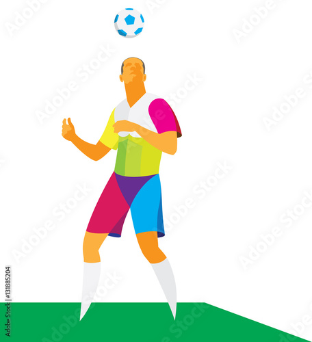 A young footballer skillfully juggles the ball head