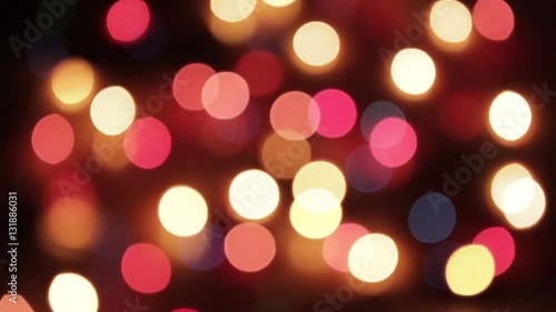 Blurry abstract colorful background. Colored Christmas garland. Bokeh and defocusing of the lens