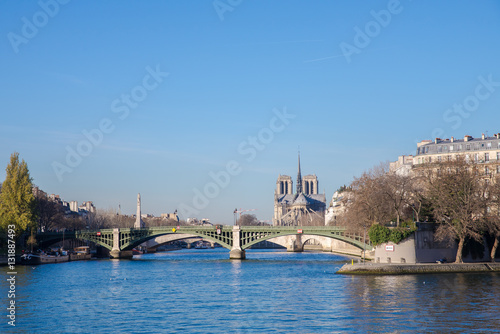 Paris, view of the Seine, ile de la Cite, with Notre-Dame cathedral in background and Sully bridge, on quays in winter